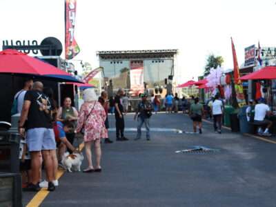 Visitors walking among food trucks at Food Trucks Heaven in Kissimmee