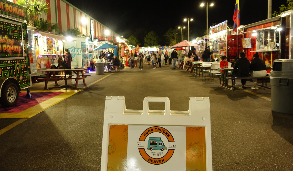 A food truck serving food with a busy crowd outside, highlighting the operation of food trucks.