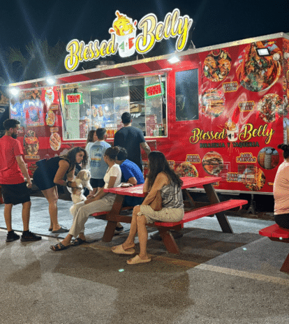 Colorful Latin food trucks in Kissimmee, Florida at Food Trucks Heaven, showcasing local culture and outdoor dining.