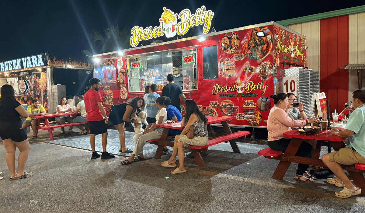 Colorful Latin food trucks in Kissimmee, Florida at Food Trucks Heaven, showcasing local culture and outdoor dining.
